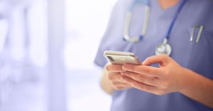 doctor-texting-on-mobile-phone